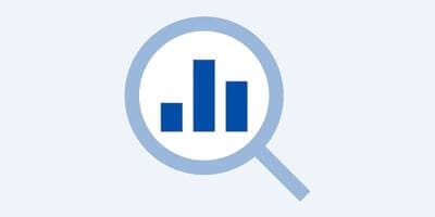 analytics chart through a magnifying glass