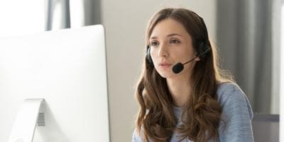 businesswoman talking on phone with headset