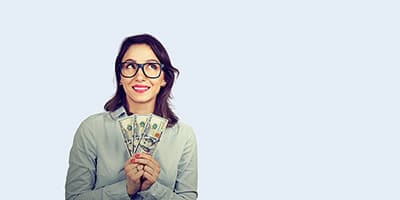 a businesswoman holding prize money