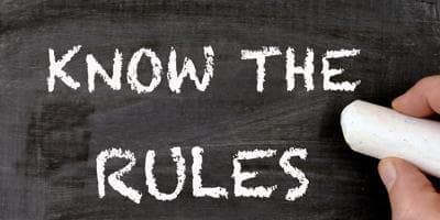 Chalkboard with know the rules written on it