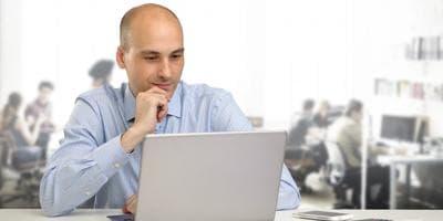 Man using laptop in the office