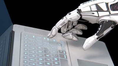 robot hand on computer