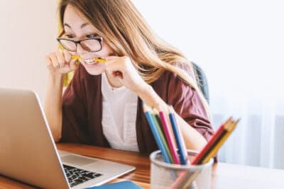 Woman reading on a laptop